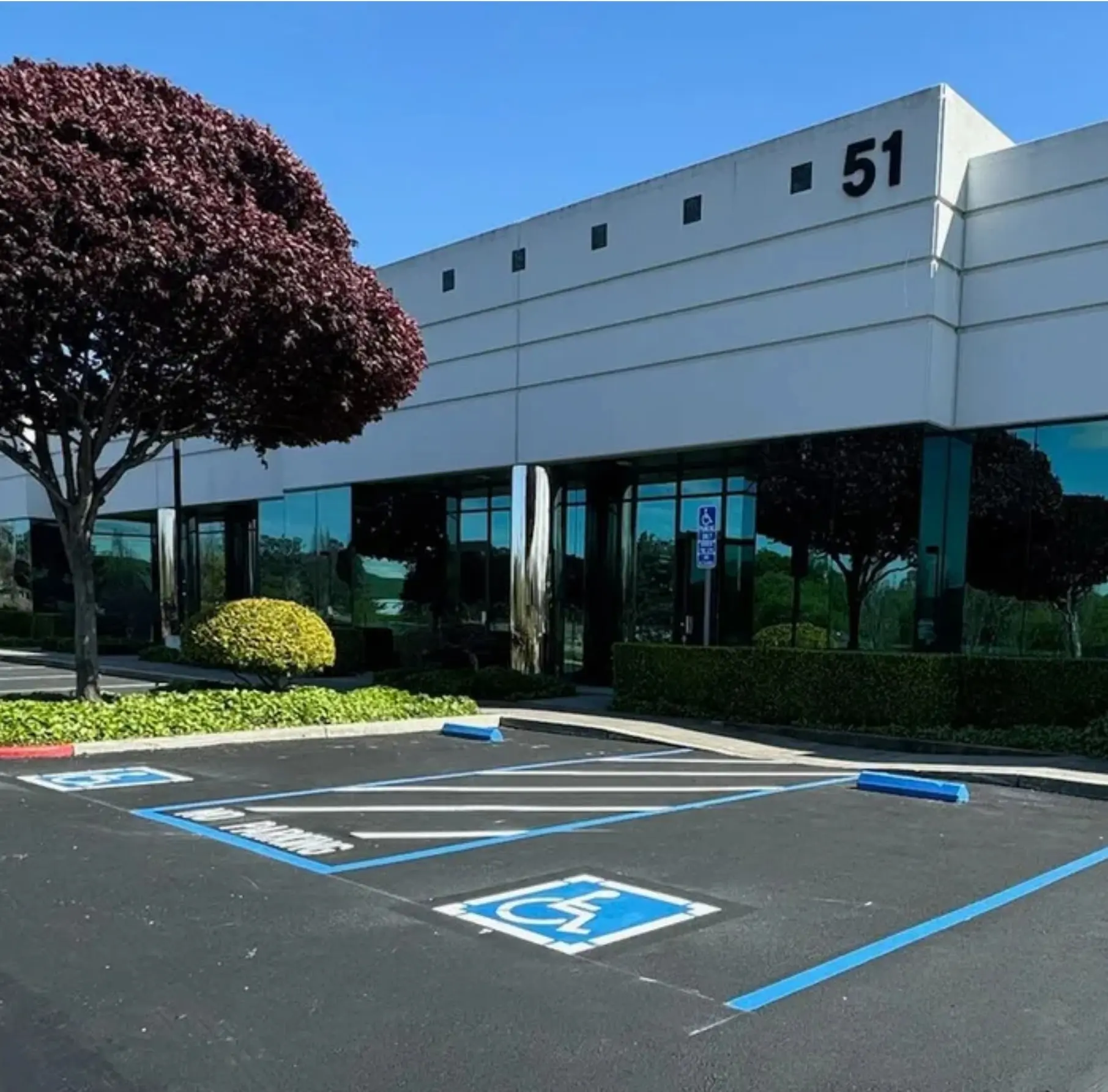 Crisp ADA-compliant parking lot striping at a Baltimore commercial property